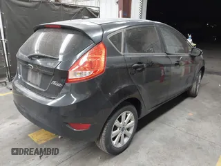 2013 Ford Fiesta SE with VIN 3FADP4EJ1DM107945, listed as a IAAI auction lot 42025064 with Not Provided miles and . Bid and sale history available at DreamBid. Image 4.