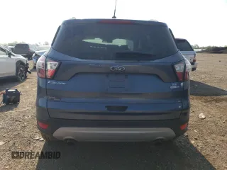 2018 Ford Escape SE z VIN 1FMCU9GD3JUA98865, wystawiony jako Copart lot #56842065 z przebiegiem 112 439 mil mil oraz Szkoda całkowita • Salvage title. Historia ofert i sprzedaży dostępna na DreamBid. Obrazek 6.
