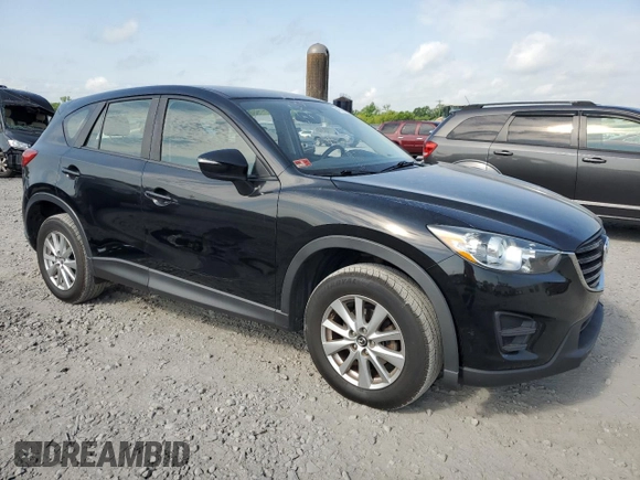 2016 Mazda CX-5 Sport with VIN JM3KE4BY6G0749973, listed as a Copart auction lot 54131635 with 97,480 mi miles and Salvage title. Bid and sale history available at DreamBid. Image 4.