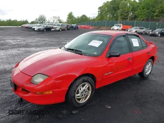 1999 Pontiac Sunfire SE z VIN 1G2JB5248X7528290, wystawiony jako IAAI lot #42252324 z przebiegiem 156 758 mil mil oraz . Historia ofert i sprzedaży dostępna na DreamBid. Obrazek 2.