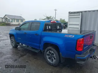 2022 Chevrolet Colorado 4WD Z71 z VIN 1GCGTDEN7N1124379, wystawiony jako IAAI lot #42372796 z przebiegiem 60 943 mil mil oraz . Historia ofert i sprzedaży dostępna na DreamBid. Obrazek 3.