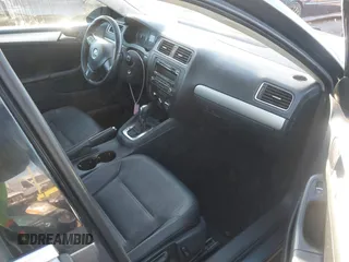 2014 Volkswagen Jetta SE z VIN 3VWD17AJ1EM285792, wystawiony jako IAAI lot #41652684 z przebiegiem 169 929 mil mil oraz . Historia ofert i sprzedaży dostępna na DreamBid. Obrazek 5.