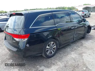 2014 Honda Odyssey Touring with VIN 5FNRL5H94EB057499, listed as a IAAI auction lot 41983956 with 158,573 mi miles and . Bid and sale history available at DreamBid. Image 4.