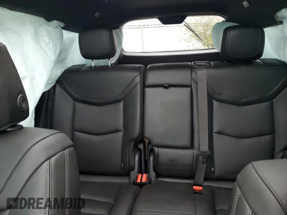 2021 Cadillac XT6 Luxury z VIN 1GYKPAR46MZ132157, wystawiony jako Copart lot #83911054 z przebiegiem 59 473 mil mil oraz Czysty tytuł • Clean title. Historia ofert i sprzedaży dostępna na DreamBid. Obrazek 10.