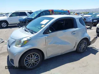 2014 Scion iQ with VIN JTNJJXB02EJ027026, listed as a IAAI auction lot 42619439 with 103,261 mi miles and . Bid and sale history available at DreamBid. Image 2.