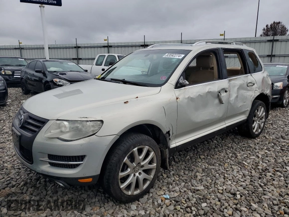 2010 Volkswagen Touareg VR6 with VIN WVGBF7A9XAD002471, listed as a Copart auction lot 83592274 with 202,497 mi miles and Salvage Title. Bid and sale history available at DreamBid. Image 1.