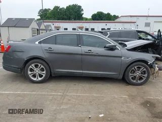 2015 Ford Taurus SEL z VIN 1FAHP2E81FG163058, wystawiony jako IAAI lot #42279778 z przebiegiem 127 957 mil mil oraz . Historia ofert i sprzedaży dostępna na DreamBid. Obrazek 13.