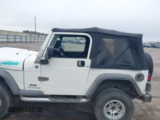 2005 Jeep Wrangler Sport with VIN 1J4FA49S25P320240, listed as a IAAI auction lot 41433371 with 144,552 mi miles. Bid and sale history available at carsss.com. Image 14.