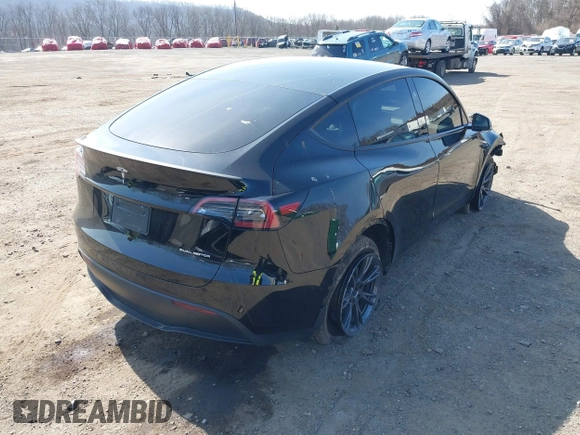 2025 Tesla Model Y Long Range with VIN 7SAYGDEEXSF267888, listed as a IAAI auction lot 41807129 with 3,002 mi miles and . Bid and sale history available at DreamBid. Image 4.