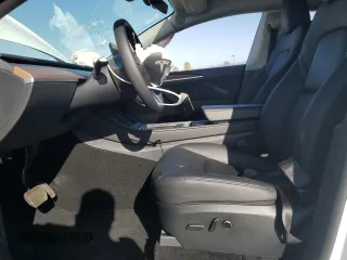 2024 Tesla Model Y with VIN 7SAYGDED1RF212974, listed as a Copart auction lot 44776005 with 16,841 mi miles and Salvage Title. Bid and sale history available at DreamBid. Image 7.
