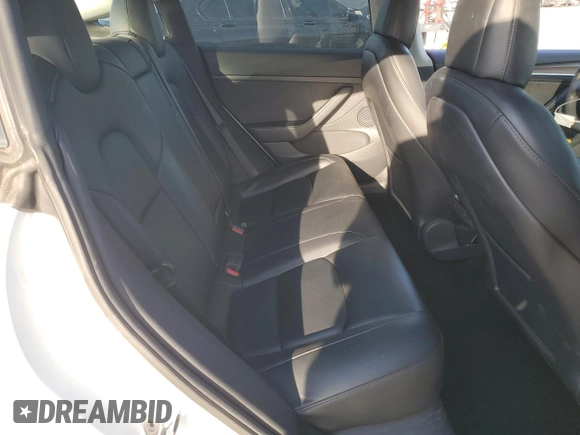 2021 Tesla Model 3 Standard Range Plus z VIN 5YJ3E1EA5MF018216, wystawiony jako Copart lot #52007385 z przebiegiem 49 711 mil mil oraz Szkoda całkowita • Salvage title. Historia ofert i sprzedaży dostępna na DreamBid. Obrazek 11.