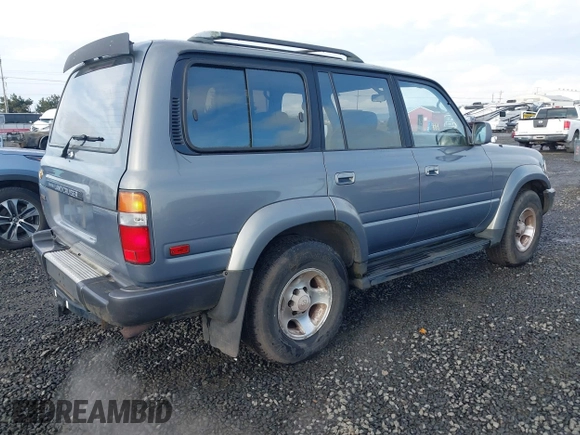 1995 Toyota Land Cruiser z VIN JT3DJ81W0S0094999, wystawiony jako IAAI lot #41583748 z przebiegiem 93 454 mil mil oraz . Historia ofert i sprzedaży dostępna na DreamBid. Obrazek 4.