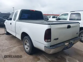 2002 Ford F-150 XL with VIN 1FTRX17202NA10047, listed as a IAAI auction lot 42122396 with 1 mi miles. Bid and sale history available at carsss.com. Image 3.