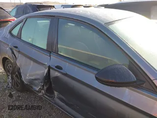 2023 Volkswagen Jetta Sport z VIN 3VWBM7BU5PM035014, wystawiony jako IAAI lot #41818798 z przebiegiem 21 202 mil mil oraz . Historia ofert i sprzedaży dostępna na DreamBid. Obrazek 13.