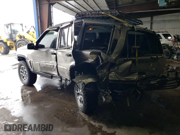 1998 Jeep Grand Cherokee Limited with VIN 1J4GZ78S9WC308708, listed as a Copart auction lot 79315694 with 205,976 mi miles and Salvage title. Bid and sale history available at DreamBid. Image 2.
