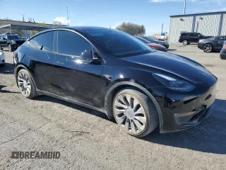 2023 Tesla Model Y Performance with VIN 7SAYGDEF8PF925238, listed as a Copart auction lot 46276925 with 28,201 mi miles and Salvage Title. Bid and sale history available at DreamBid. Image 4.