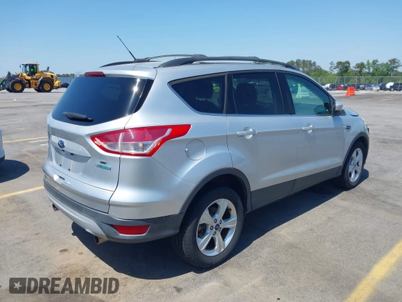 2013 Ford Escape SE with VIN 1FMCU0GX0DUA19811, listed as a IAAI auction lot 42009015 with 135,662 mi miles. Bid and sale history available at carsss.com. Image 4.