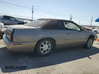 2002 Cadillac Eldorado Touring ETC z VIN 1G6ET12952B101866, wystawiony jako Copart lot #57365965 z przebiegiem Nie podano mil oraz Tytuł czysty. Historia ofert i sprzedaży dostępna na DreamBid. Obrazek 3.
