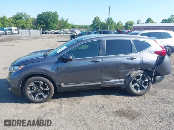 2018 Honda CR-V Touring z VIN 5J6RW2H93JL004834, wystawiony jako IAAI lot #42351364 z przebiegiem 63 746 mil mil oraz . Historia ofert i sprzedaży dostępna na DreamBid. Obrazek 14.