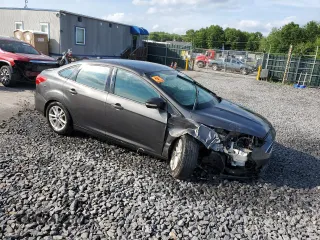 2016 Ford Focus SE z VIN 1FADP3F24GL313333, wystawiony jako Copart lot #60023715 z przebiegiem Nie podano mil oraz Szkoda całkowita • Salvage title. Historia ofert i sprzedaży dostępna na DreamBid. Obrazek 4.