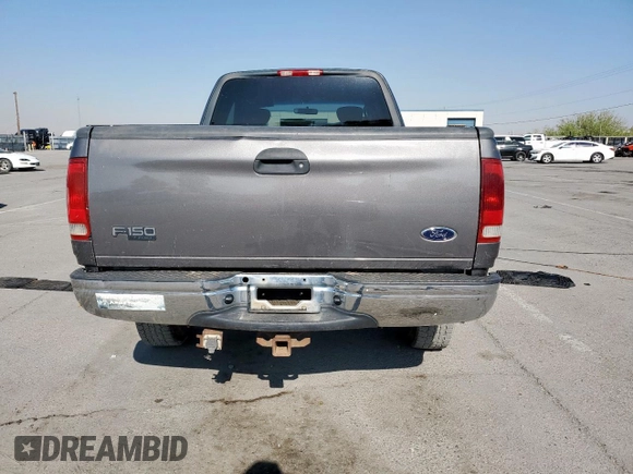2002 Ford F-150 XL with VIN 1FTPX18L32NB65156, listed as a Copart auction lot 61418955 with 176,622 mi miles and Salvage title. Bid and sale history available at DreamBid. Image 6.