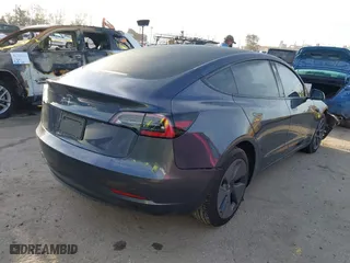 2023 Tesla Model 3 with VIN 5YJ3E1EA9PF569494, listed as a IAAI auction lot 41798014 with 18,372 mi miles. Bid and sale history available at carsss.com. Image 4.