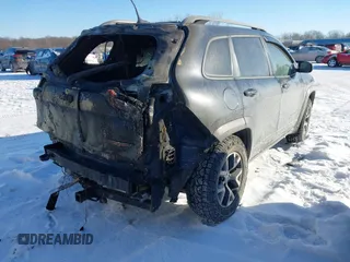 2014 Jeep Cherokee Trailhawk with VIN 1C4PJMBS8EW182259, listed as a IAAI auction lot 41309329 with Not Provided miles. Bid and sale history available at carsss.com. Image 4.