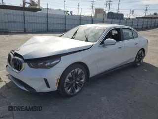 2024 BMW i5 eDrive40 with VIN WBY33FK09RCR63560, listed as a Copart auction lot 85152054 with 2,973 mi miles and Salvage Title. Bid and sale history available at carsss.com. Image 1.