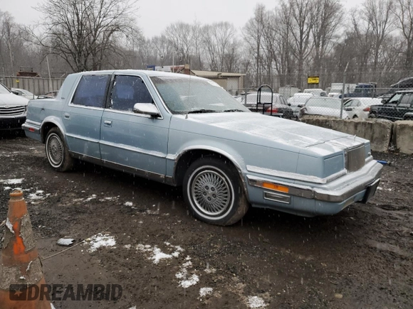 1989 Chrysler New Yorker z VIN 1C3BC4632KD549983, wystawiony jako Copart lot #44415435 z przebiegiem 44 683 mil mil oraz Szkody całkowita. Historia ofert i sprzedaży dostępna na DreamBid. Obrazek 4.