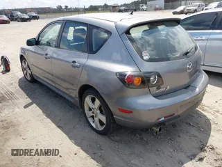 2005 Mazda 3 s with VIN JM1BK343151259901, listed as a IAAI auction lot 42028513 with 209,689 mi miles. Bid and sale history available at carsss.com. Image 3.