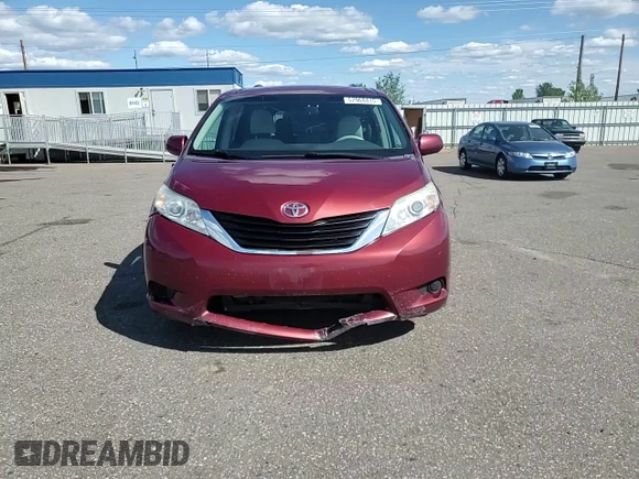 2012 Toyota Sienna LE AAS with VIN 5TDKK3DC7CS195590, listed as a Copart auction lot 57968415 with 201,732 mi miles and Salvage title. Bid and sale history available at DreamBid. Image 14.