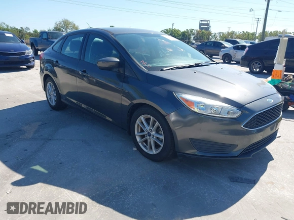 2018 Ford Focus SE z VIN 1FADP3F27JL245603, wystawiony jako IAAI lot #41773395 z przebiegiem 94 044 mil mil oraz . Historia ofert i sprzedaży dostępna na DreamBid. Obrazek 1.