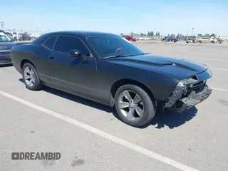 2016 Dodge Challenger SXT Plus z VIN 2C3CDZAG4GH184435, wystawiony jako IAAI lot #42162973 z przebiegiem 168 495 mil mil oraz . Historia ofert i sprzedaży dostępna na DreamBid. Obrazek 1.