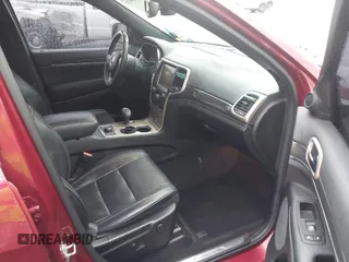 2014 Jeep Grand Cherokee Overland with VIN 1C4RJFCG9EC460165, listed as a IAAI auction lot 42092137 with 131,802 mi miles and . Bid and sale history available at DreamBid. Image 5.