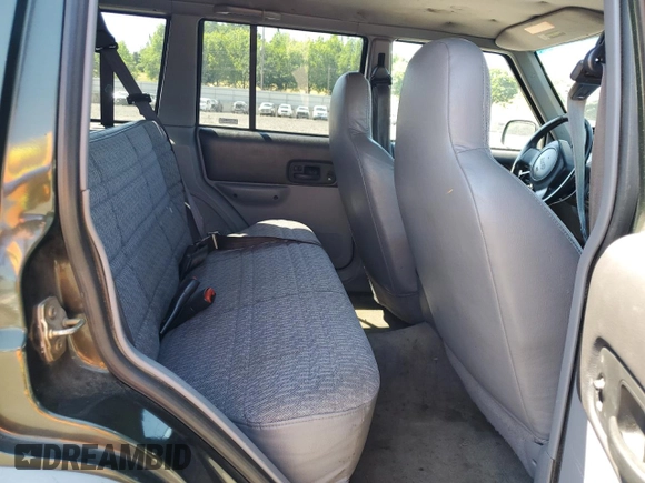1998 Jeep Cherokee Sport with VIN 1J4FJ68S5WL108020, listed as a Copart auction lot 60150655 with 290,595 mi miles and Salvage title. Bid and sale history available at DreamBid. Image 11.