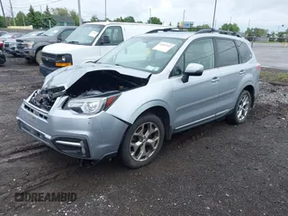 2018 Subaru Forester Touring with VIN JF2SJAWC6JH496875, listed as a IAAI auction lot 42347532 with 70,978 mi miles and . Bid and sale history available at DreamBid. Image 17.