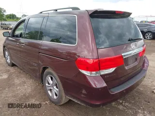 2009 Honda Odyssey Touring with VIN 5FNRL38929B037150, listed as a IAAI auction lot 42319657 with 183,663 mi miles and . Bid and sale history available at DreamBid. Image 3.