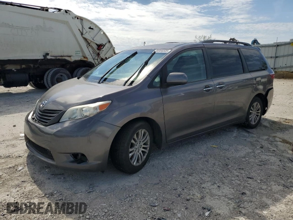 2015 Toyota Sienna XLE with VIN 5TDYK3DC5FS643985, listed as a Copart auction lot 56956505 with 179,131 mi miles and Salvage title. Bid and sale history available at DreamBid. Image 1.
