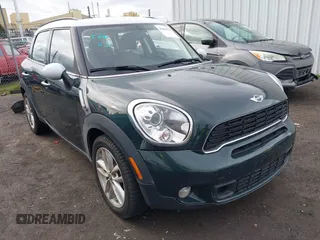 2013 MINI Countryman S z VIN WMWZC3C5XDWP20820, wystawiony jako IAAI lot #41461473 z przebiegiem 66 326 mil mil oraz . Historia ofert i sprzedaży dostępna na DreamBid. Obrazek 1.