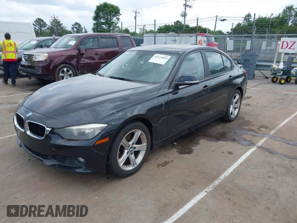 2012 BMW 3 Series 328i with VIN WBA3A5G51CNP17522, listed as a IAAI auction lot 42124868 with 154,385 mi miles and . Bid and sale history available at carsss.com. Image 2.