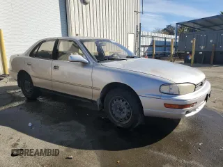 1994 Toyota Camry LE z VIN JT2GK12EXR0070117, wystawiony jako Copart lot #75997244 z przebiegiem 185 759 mil mil oraz Czysty tytuł • Clean title. Historia ofert i sprzedaży dostępna na DreamBid. Obrazek 4.