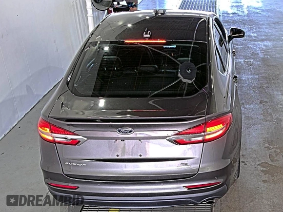 2020 Ford Fusion SE z VIN 3FA6P0HD6LR189762, wystawiony jako IAAI lot #42780149 z przebiegiem 51 099 mil mil oraz . Historia ofert i sprzedaży dostępna na DreamBid. Obrazek 6.