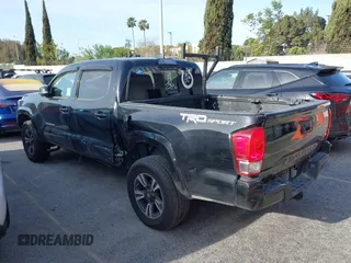 2017 Toyota Tacoma SR5 with VIN 5TFAZ5CN0HX053573, listed as a IAAI auction lot 41797867 with 102,628 mi miles and . Bid and sale history available at DreamBid. Image 3.