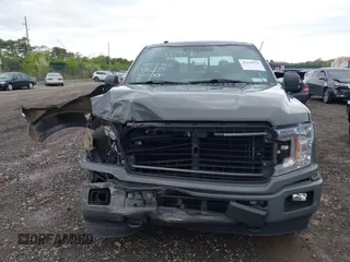 2018 Ford F-150 XL with VIN 1FTEW1EPXJFC85210, listed as a IAAI auction lot 42150759 with 97,660 mi miles and . Bid and sale history available at carsss.com. Image 12.