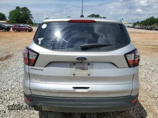 2018 Ford Escape S with VIN 1FMCU0F78JUB79464, listed as a Copart auction lot 58812925 with 104,642 mi miles and Salvage title. Bid and sale history available at DreamBid. Image 6.