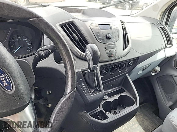2016 Ford Transit Cargo with VIN 1FTYE1ZM1GKA06047, listed as a IAAI auction lot 42679265 with 124,601 mi miles and . Bid and sale history available at DreamBid. Image 6.
