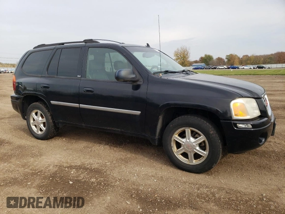 2007 GMC Envoy SLT with VIN 1GKDT13S972197393, listed as a Copart auction lot 77958764 with 151,586 mi miles and Salvage Title. Bid and sale history available at DreamBid. Image 4.