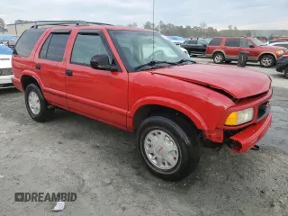 1996 GMC Jimmy SL with VIN 1GKDT13WXT2502347, listed as a Copart auction lot 74502444 with 253,735 mi miles and Salvage Title. Bid and sale history available at carsss.com. Image 4.