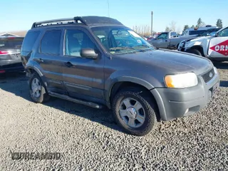 2003 Ford Escape XLT Popular 2 with VIN 1FMCU93143KB10936, listed as a IAAI auction lot 41414430 with 170,050 mi miles. Bid and sale history available at carsss.com. Image 1.