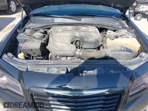 2013 Chrysler 300 with VIN 2C3CCAAGXDH660851, listed as a IAAI auction lot 41970721 with 112,017 mi miles and . Bid and sale history available at carsss.com. Image 10.